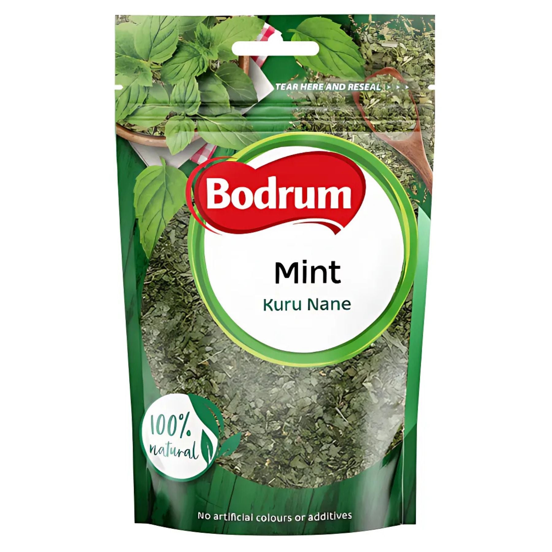 Bodrum Dried Mint - 50g comes in a green and white pack labeled "Mint Kuru Nane," with "100% natural" and "No artificial colours or additives." This aromatic spice is ideal for adding fresh flavor to your dishes. Bodrum Dried Mint - 50g comes in a green and white pack labeled "Mint Kuru Nane," with "100% natural" and "No artificial colours or additives." This aromatic spice is ideal for adding fresh flavor to your dishes.