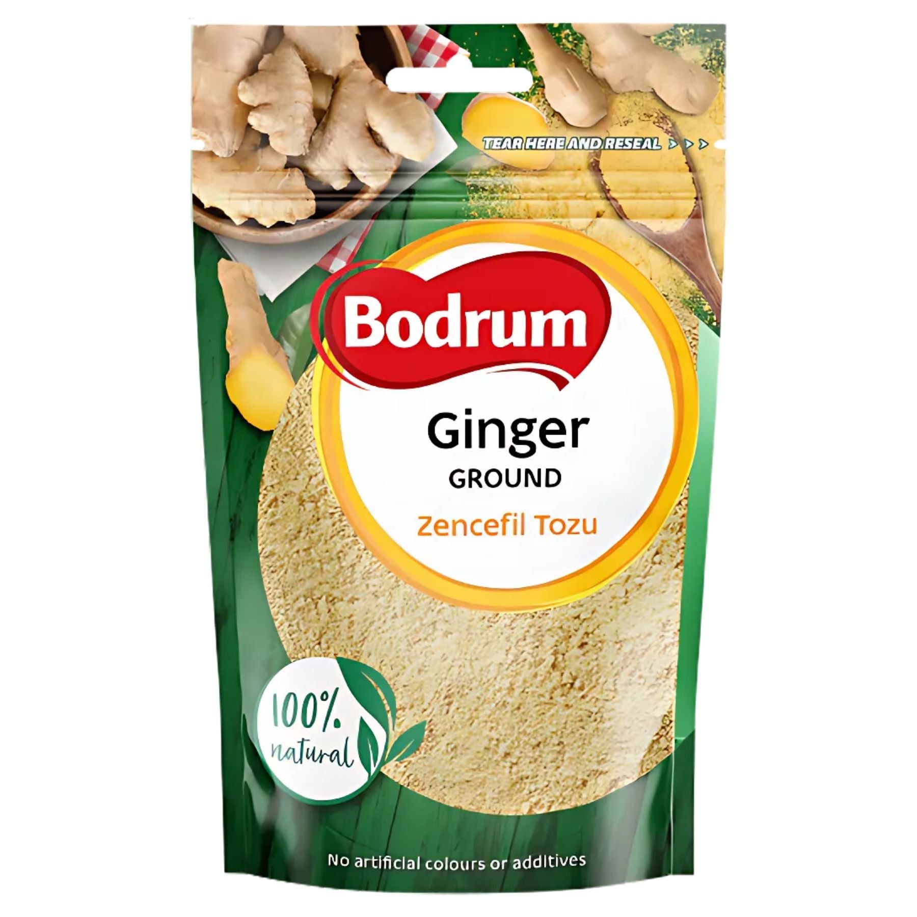 A 100g pack of Bodrum Ginger Powder labeled "100% natural," with images of ginger root and powder on the front. The packaging features text in both English and Turkish, making it perfect for cooking. A 100g pack of Bodrum Ginger Powder labeled "100% natural," with images of ginger root and powder on the front. The packaging features text in both English and Turkish, making it perfect for cooking.