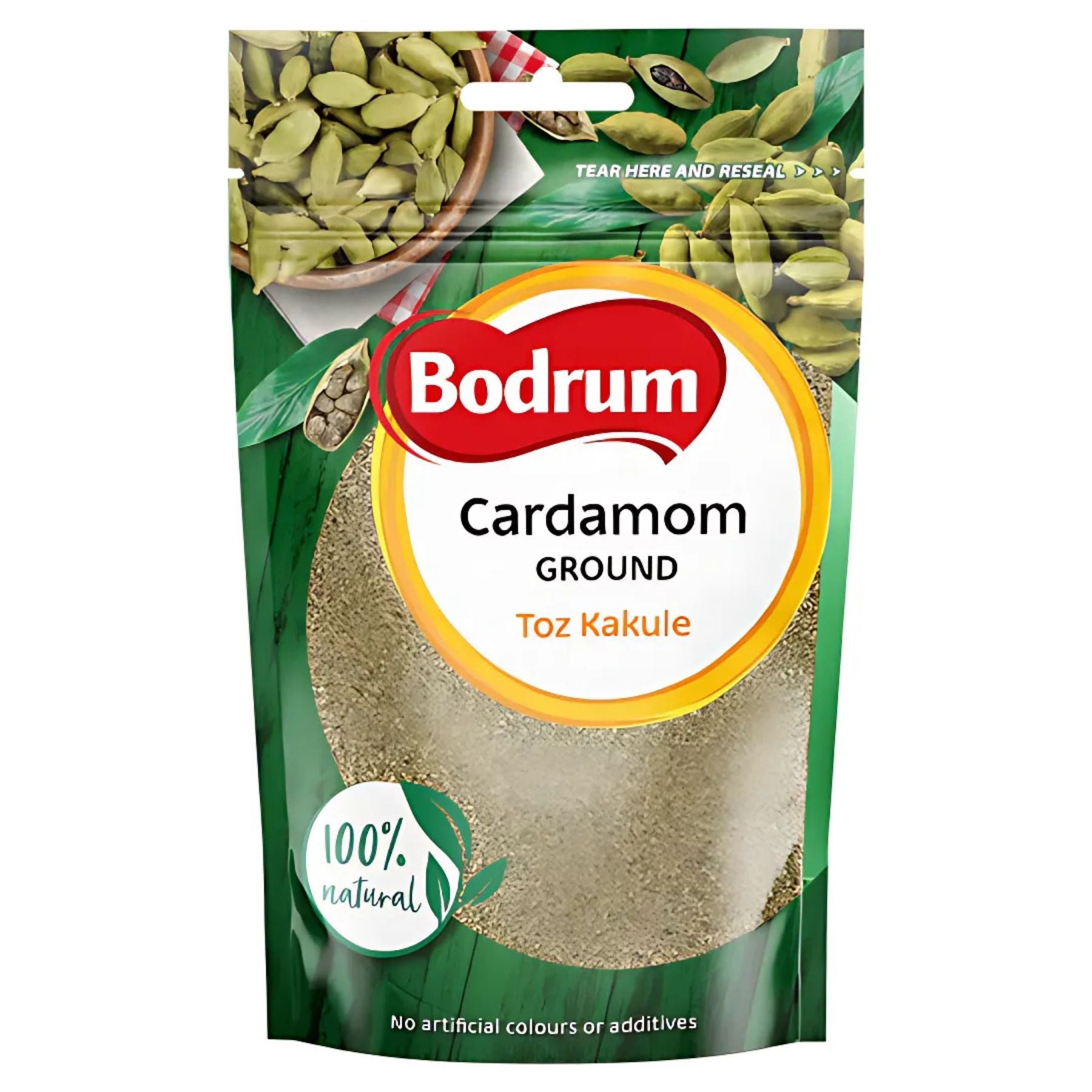 A 50g pack of Bodrum Ground Cardamom Powder, labeled "100% natural" with no artificial colors or additives, featuring images of cardamom pods. A 50g pack of Bodrum Ground Cardamom Powder, labeled "100% natural" with no artificial colors or additives, featuring images of cardamom pods.