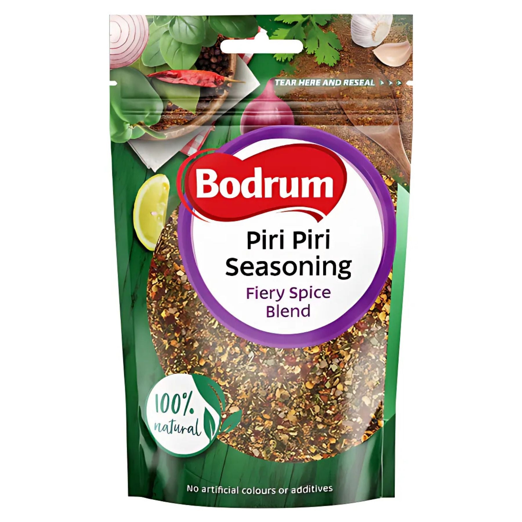 A packet of Bodrum Piri Piri Seasoning 75g, labeled 100% natural with no artificial colors or additives, is displayed against a leafy green background, emphasizing the vibrant appeal of this fiery spice blend. A packet of Bodrum Piri Piri Seasoning 75g, labeled 100% natural with no artificial colors or additives, is displayed against a leafy green background, emphasizing the vibrant appeal of this fiery spice blend.