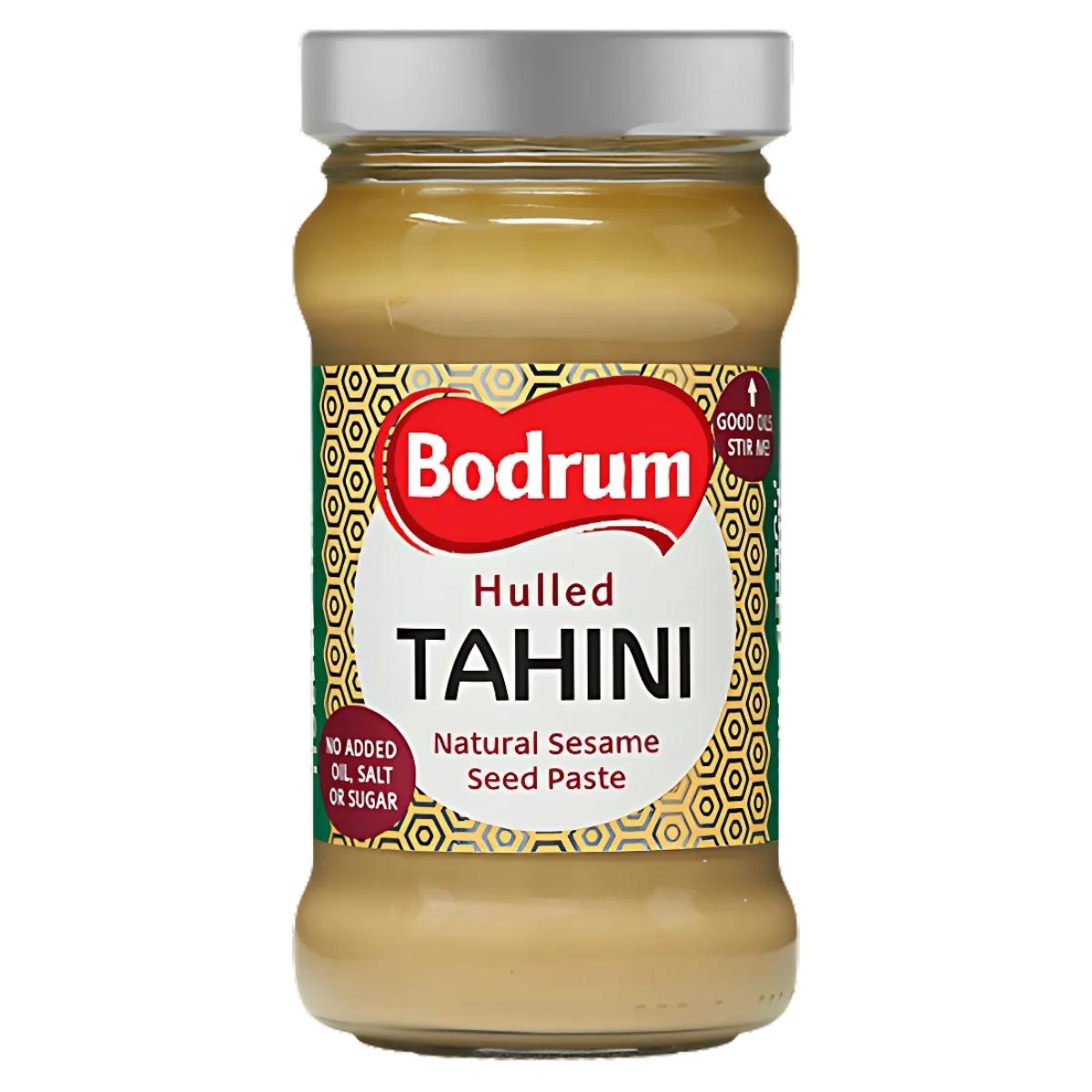 300g jar of Bodrum Tahini Sesame Seed Paste with a gold and green label, featuring "Natural Sesame Seed Paste" and "No Added Oil, Salt, or Sugar. 300g jar of Bodrum Tahini Sesame Seed Paste with a gold and green label, featuring "Natural Sesame Seed Paste" and "No Added Oil, Salt, or Sugar.
