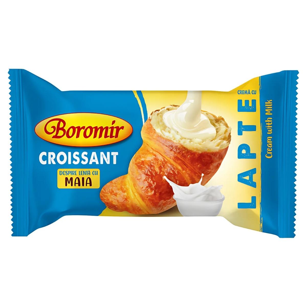 A Boromir Croissant with Milk Cream Filling (60g) is packaged in a blue and yellow wrapper featuring an image of the pastry and a cream splash. A Boromir Croissant with Milk Cream Filling (60g) is packaged in a blue and yellow wrapper featuring an image of the pastry and a cream splash.