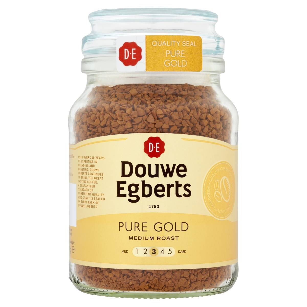 A 95g glass jar of Douwe Egberts Pure Gold DE Medium Roast coffee, featuring a yellow label and red logo, delivers an aromatic experience in every cup. A 95g glass jar of Douwe Egberts Pure Gold DE Medium Roast coffee, featuring a yellow label and red logo, delivers an aromatic experience in every cup.