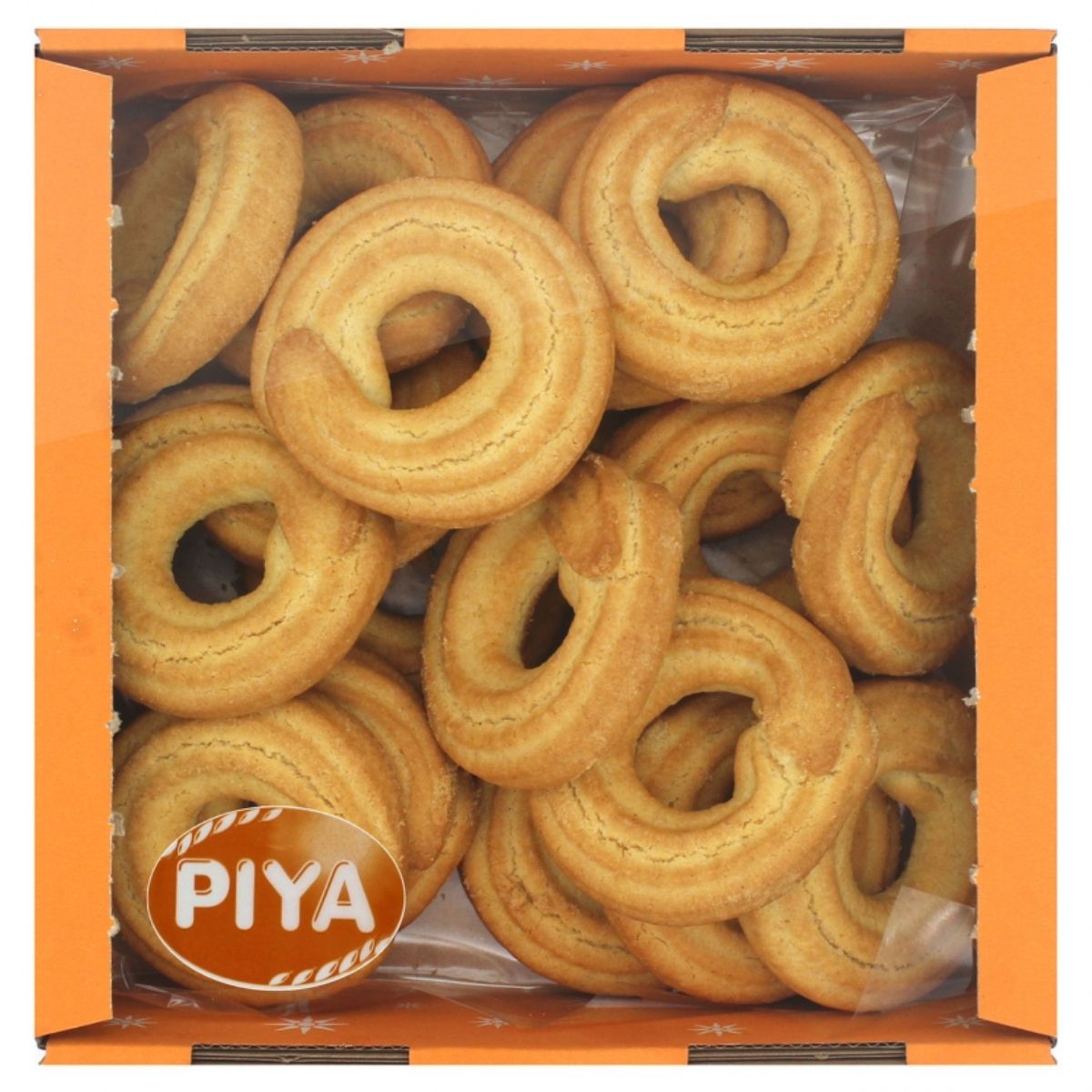 Piya cookies with butter in a box on a white background. Piya cookies with butter in a box on a white background.