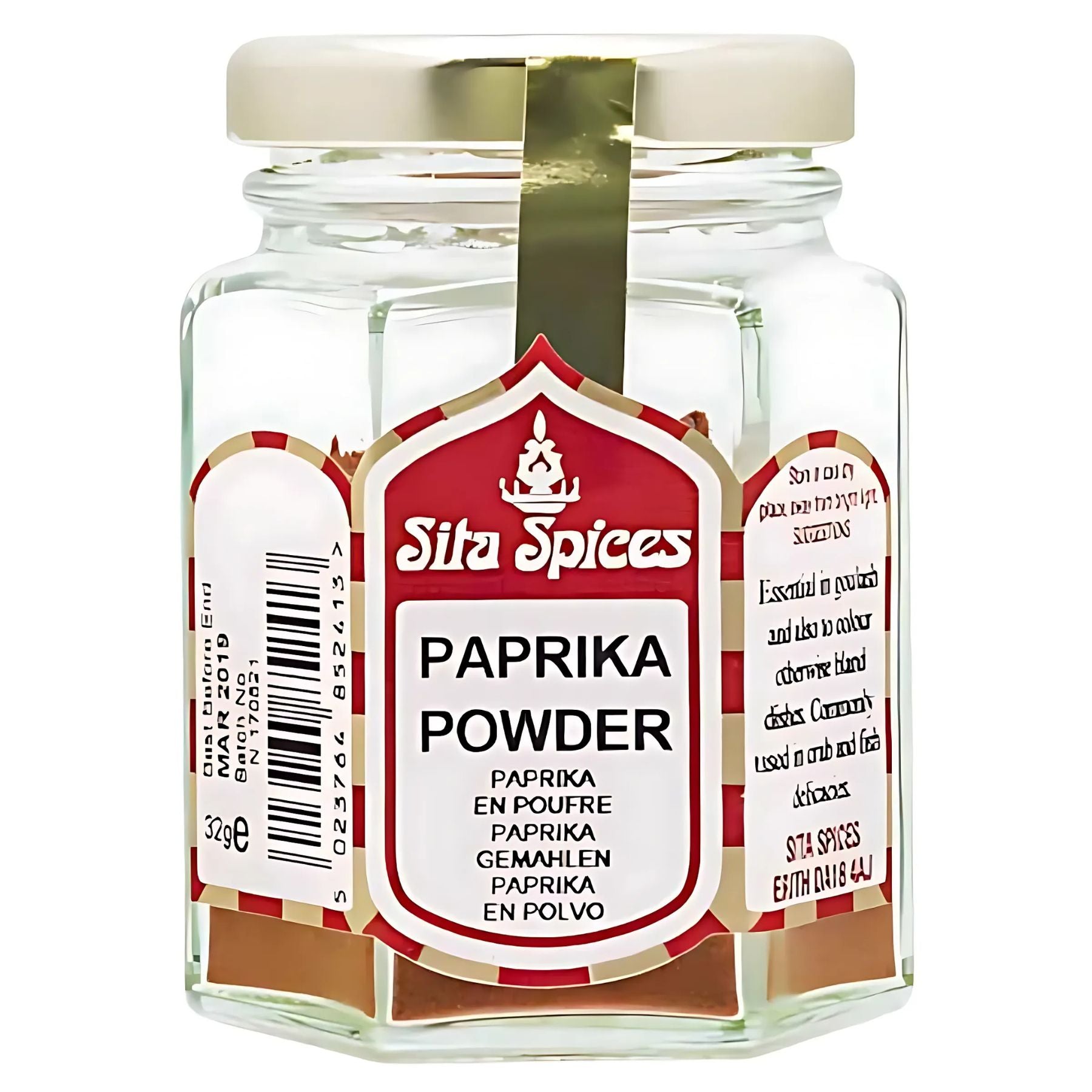 A clear glass jar of Sita Spices - Paprika Powder - 30g with a white and red label featuring spice details and ingredients in multiple languages. A clear glass jar of Sita Spices - Paprika Powder - 30g with a white and red label featuring spice details and ingredients in multiple languages.