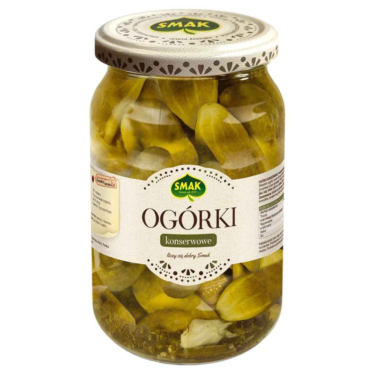 Jar of pickled cucumbers labeled "Smak - Pickled Cucumbers - 860g" with the "SMAK" brand logo on the lid and label. Jar of pickled cucumbers labeled "Smak - Pickled Cucumbers - 860g" with the "SMAK" brand logo on the lid and label.