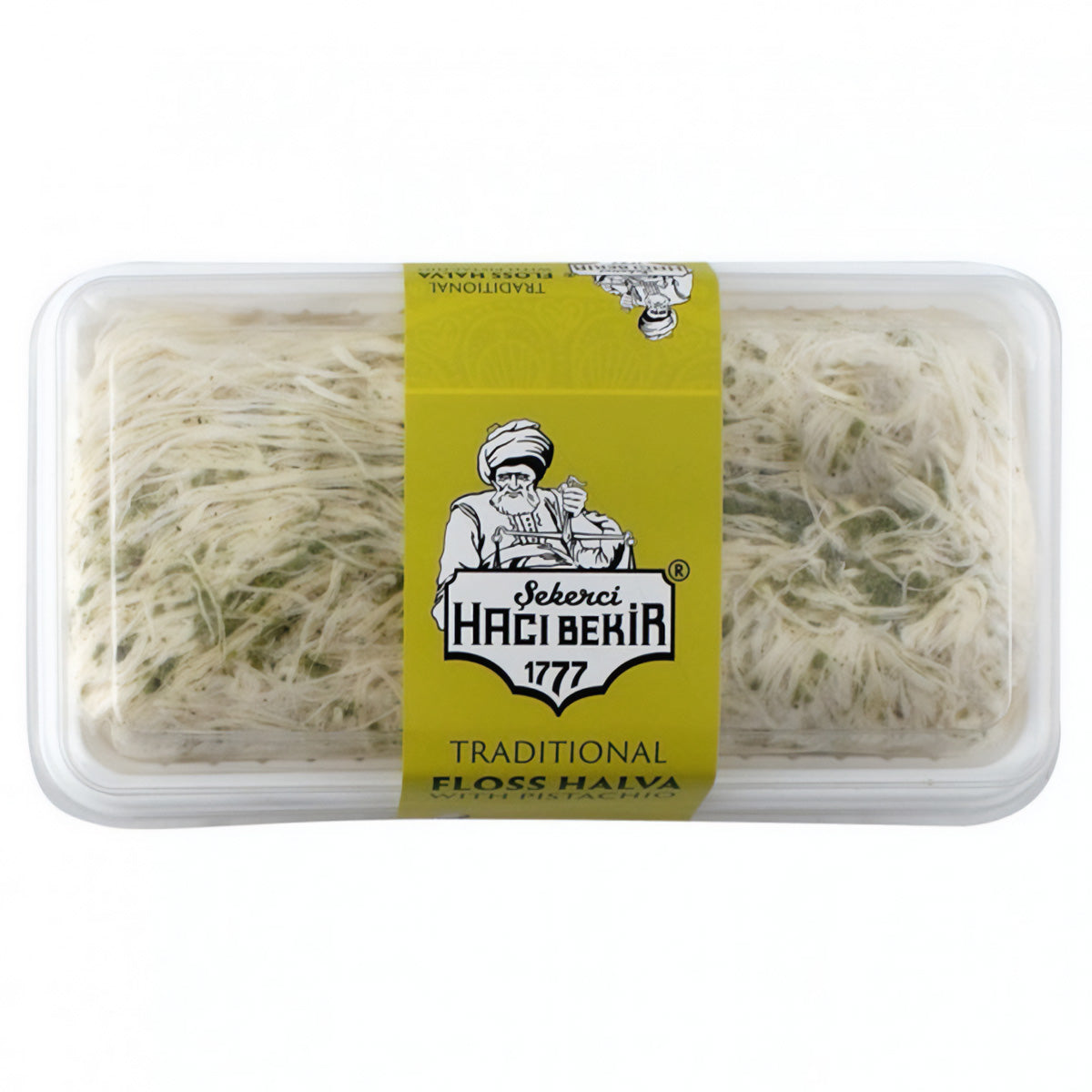 A clear plastic container of Haci Bekir - Pismaniye Floss Halva with Pistachio (200g), showing fine strands of traditional Turkish halva and a yellow label with the brand logo. A clear plastic container of Haci Bekir - Pismaniye Floss Halva with Pistachio (200g), showing fine strands of traditional Turkish halva and a yellow label with the brand logo.