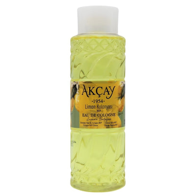 A clear plastic bottle of Akcay Lemon Kolonya Scented Hand Sanitiser (300ml) with yellow liquid, a white cap, and a label showing lemons and product details.