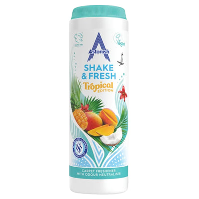 A 350g cylindrical container of Astonish - Shake & Fresh Tropical Carpet Freshener, adorned with vibrant fruit and leaf imagery on a white background, emphasizing its refreshing scent and lively ingredients.