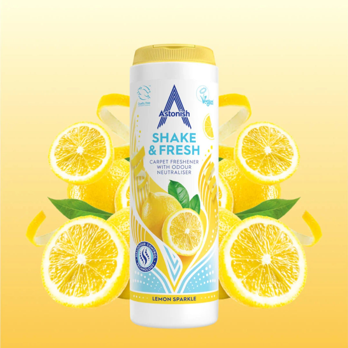 A 350g container of Astonish Shake & Fresh Lemon Sparkle Carpet Freshener is displayed alongside sliced lemons, set against a yellow gradient background.