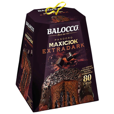 A pyramid-shaped package of Balocco Maxciok Extradark chocolate cake, featuring a dark purple and black design with a yellow loop at the top, set against a plain white background.