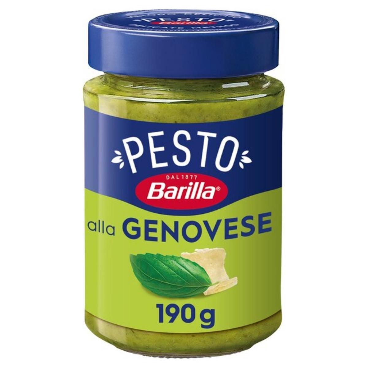 Barilla's 190g Genovese Pesto comes in a jar with a blue lid and green label, featuring Italian-inspired basil leaf and Parmigiano-Reggiano cheese illustrations to capture its classic flavors.