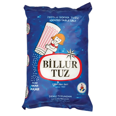 A 1.5kg package of Billur Table Salt, in blue, with a cartoon girl pouring salt from a shaker and bilingual Turkish-English text.
