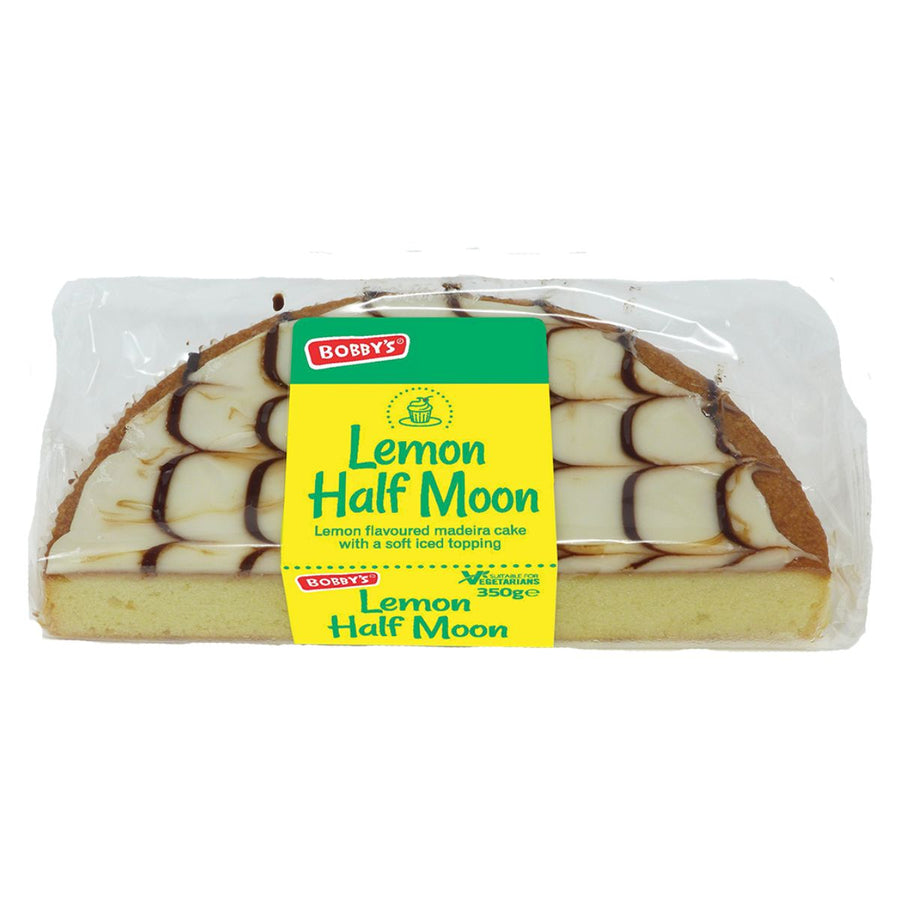 A 350g Bobby’s Lemon Half Moon Cake, featuring white and brown icing and labeled as a lemon-flavored madeira cake, comes in clear wrapping—this zesty citrus treat from Bobby’s is perfect for any occasion.