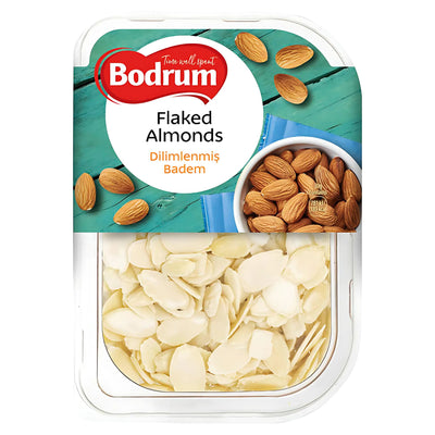 A plastic container of Bodrum - Flaked Almonds - 150g, featuring a label with images of whole almonds and text in English and Turkish.