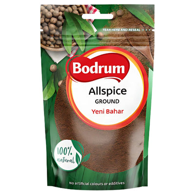 A 100g pack of Bodrum - Ground Allspice features a green and red design, highlights "100% natural" and "No artificial colours or additives," and delivers balanced, aromatic spice for seasoning.