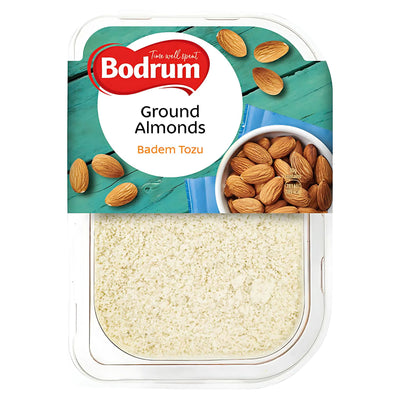 A 150g clear plastic container of Bodrum Grounded Almonds, labeled in English and Turkish with whole almonds pictured—perfect for vegan recipes and baking.