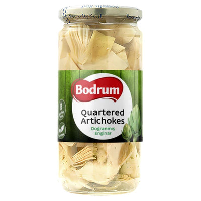 A 680g glass jar of Bodrum Marinated Quartered Artichokes with a green and white label, containing tender Mediterranean artichoke hearts, quartered and ready to serve.