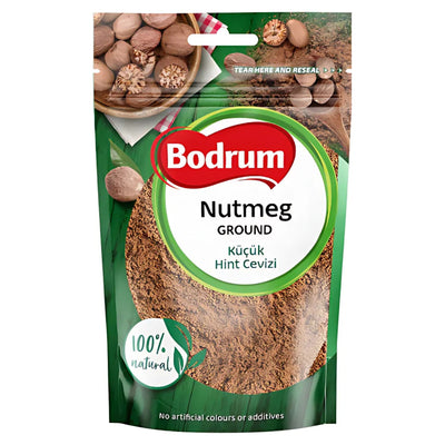 A 50g pack of Bodrum Nutmeg Ground Powder, labeled 100% natural with no artificial colors or additives. The green package shows ground nutmeg and whole nutmegs—ideal for baking.