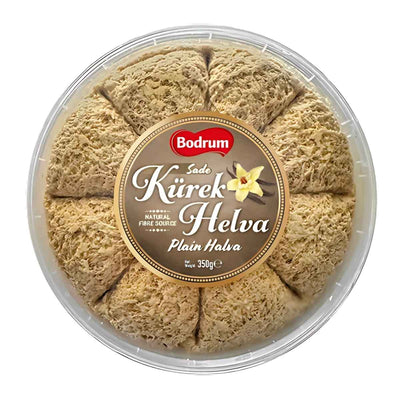 A round 350g Bodrum Plain Kurek Halva, divided into eight segments, comes in a clear-lidded plastic container with a central label, featuring classic sesame halva flavor.