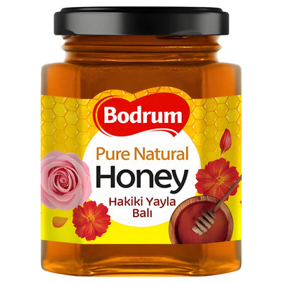 A 250g jar of Bodrum Pure Natural Honey with a black lid, decorated with floral patterns and a honey dipper illustration on the label.