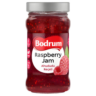 A 380g glass jar of Bodrum Raspberry Jam with a silver lid, showing raspberries and bilingual text on the label, made from natural fruit for authentic flavor.