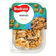 A 100g plastic container of Bodrum Walnut features a blue and green label in English and Turkish, emphasizing premium quality walnuts inside.