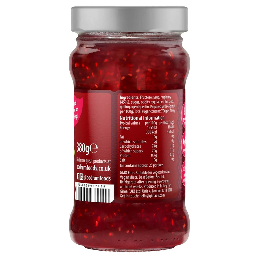 A 380g glass jar of Bodrum Raspberry Jam displays the ingredients and nutrition label on the back, featuring natural fruit.