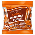 A 400g bag of Bogutti Luxury Caramel Fudges from Poland features gourmet caramel treats in cow-themed packaging with English and Arabic text.