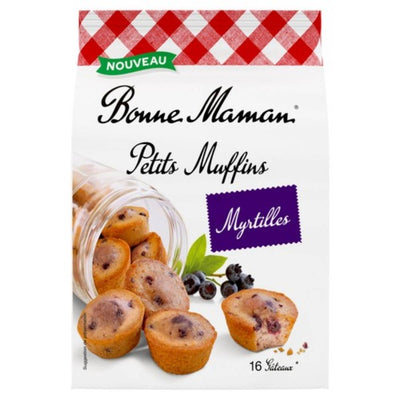 Bonne Maman - Blueberry Petits Muffins (235g): delicious French mini muffins, shown spilling from a jar with blueberries and green leaves beside them.