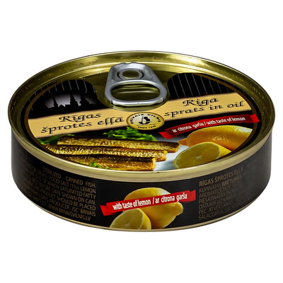 Brivais Vilnis - Riga Sprats in Oil with Taste of Lemon (112g) offers smoked sprats in oil, with a label showing fish and lemon slices—a true taste of Baltic seafood.