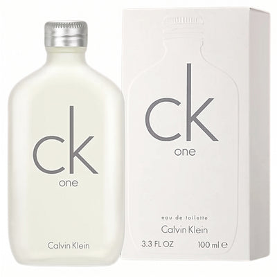 A bottle of CK One - Unisex Eau de Toilette - 100ml is displayed beside its matching box, both labeled “CK One.” The bottle holds 100 ml (3.3 FL OZ) of eau de toilette.
