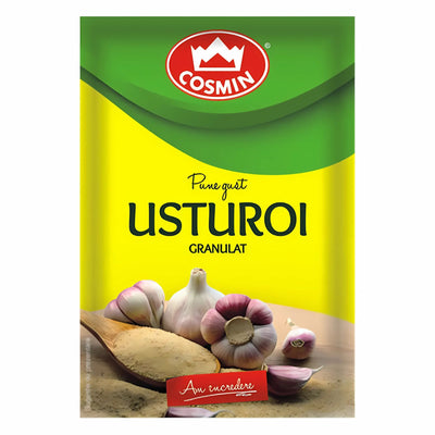A 15g packet of Cosmin Granulated Garlic Powder with garlic bulbs, cloves, and granules on the front label.