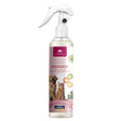 A bottle of Cristalinas Room Spray Pet Collection, featuring a white trigger spray top and a clear bottle showing a light-colored liquid inside. The label is white with pink accents, featuring images of a golden retriever and a cat, and text indicating it fights odours and fresheners.