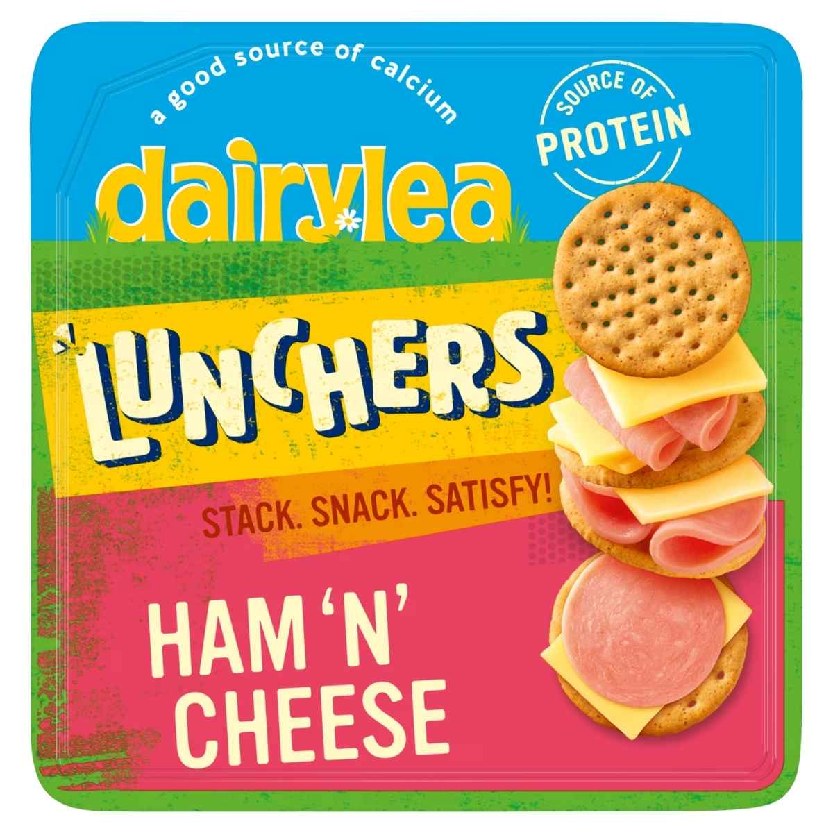 Dairylea Lunchers Ham 'N' Cheese 65g by Dairylea offers a handy lunch box with crackers, ham, and cheese slices, all stacked together, featuring labels that highlight its calcium and protein content.