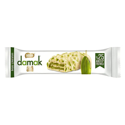 Nestle Damak - Ala White Chocolate Wafer Bar With Pistachios (30g) features green and white branding, white packaging, and images of the pistachio-filled bar and pistachio—an irresistible chocolate treat.