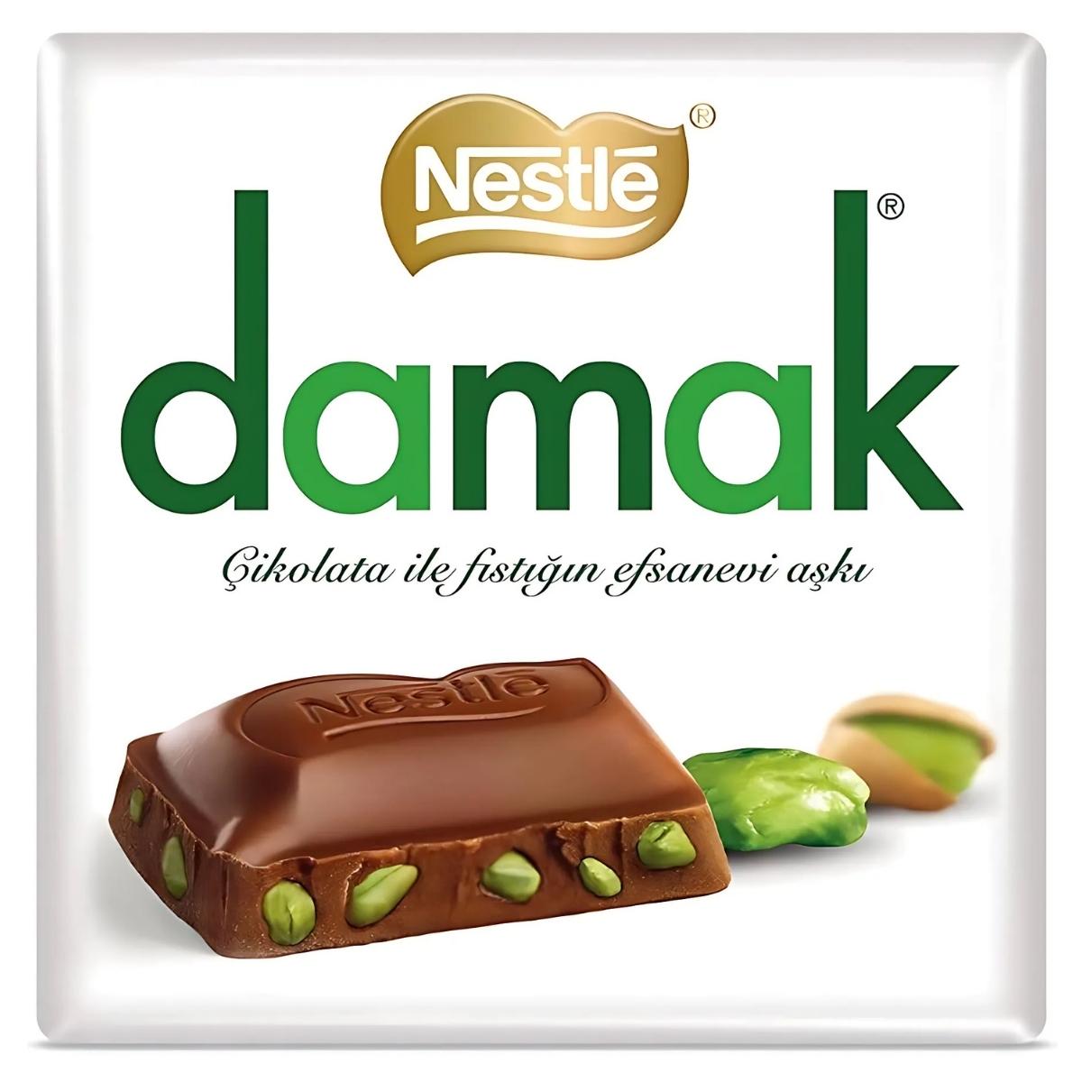 An enticing image of the Damak - Fine Chocolate with Pistachios - 60g by Nestlé showcases its unique combination of premium chocolate and luscious, flavorful pistachios on the packaging.