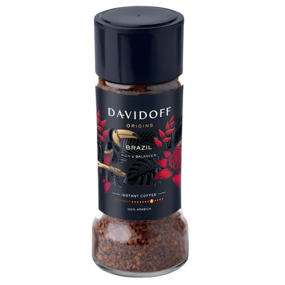 A 90g jar of Davidoff Rich & Balanced Brazil Instant Coffee, featuring a black lid and a label with tropical birds and plants that celebrate the vibrant spirit of Brazilian coffee.