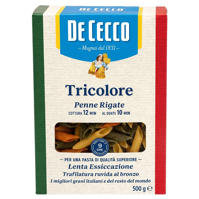 A 500g package of De Cecco Tricolore penne rigate pasta, featuring the brand's signature blue, green, and red vertical stripes on a cream-colored background with a clear window showing the pasta inside.