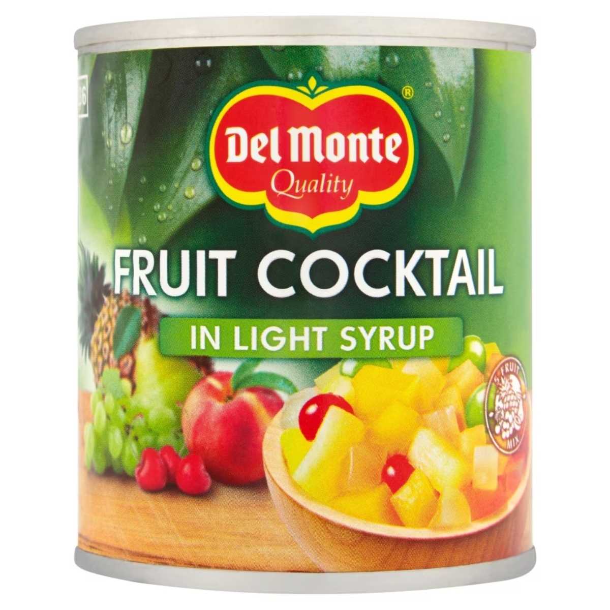 A can of Del Monte Fruit Cocktail in Light Syrup, with a label showcasing images of various fruits such as pineapples, grapes, and cherries.