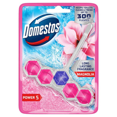 The Domestos Power 5 Magnolia Rim Block 50g features pink and purple blocks on its packaging, a magnolia flower image, and highlights its refreshing scent and long-lasting use.