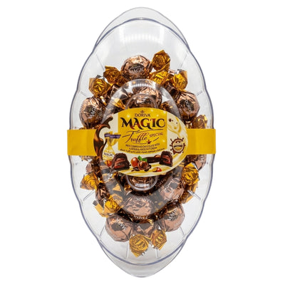 A clear plastic egg-shaped container filled with wrapped chocolates, featuring a yellow band around the center with a Doriva Magic Truffle Special label.
