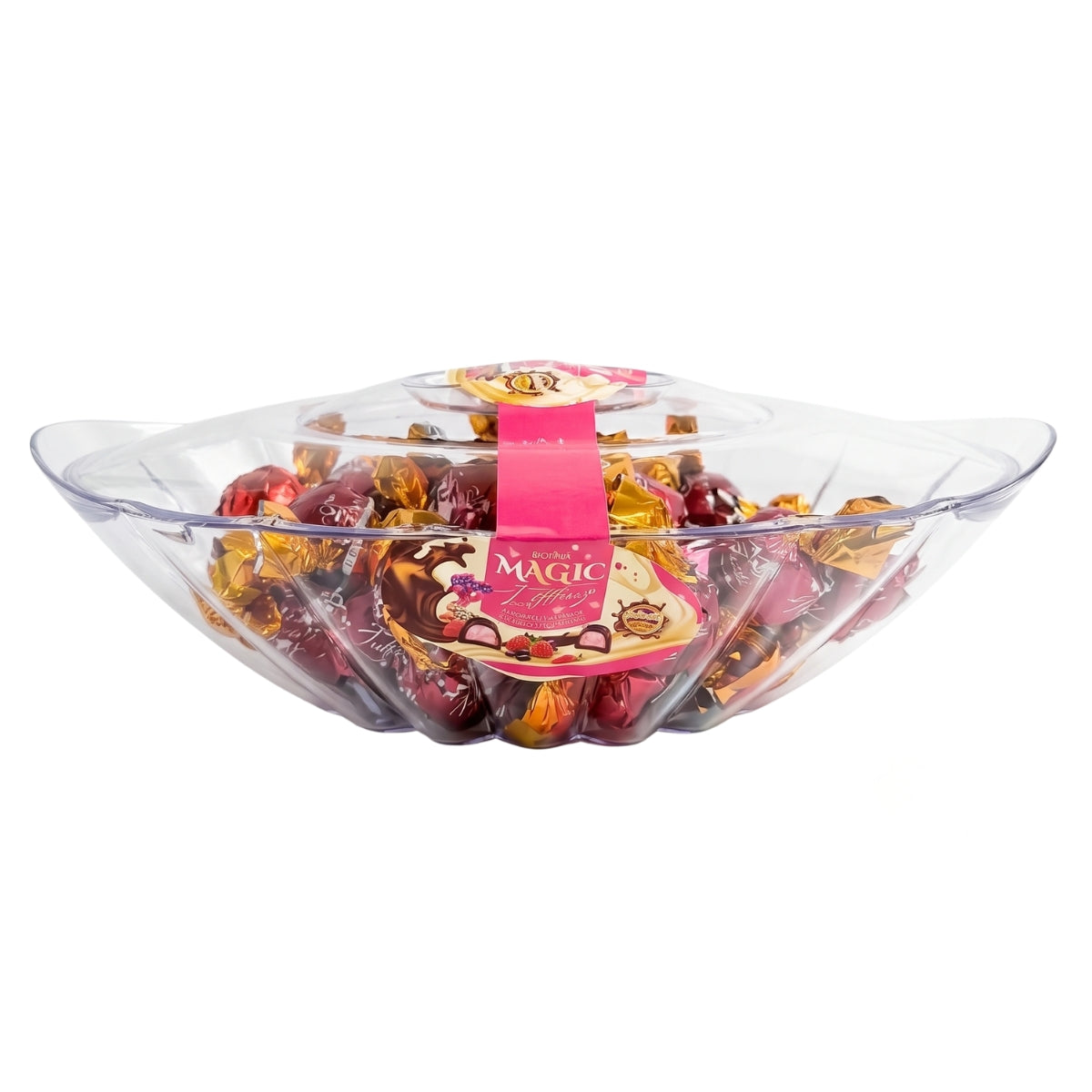 A clear plastic tray containing individually wrapped Doriva Magic milk chocolate truffles with strawberry cream, featuring a pink and gold “Magic” label across the top of the 540g gift box.