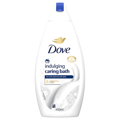 A 450ml bottle of Dove Indulging Caring Bath Moisturising Cream, designed for soft and smooth skin, with a white and blue label.