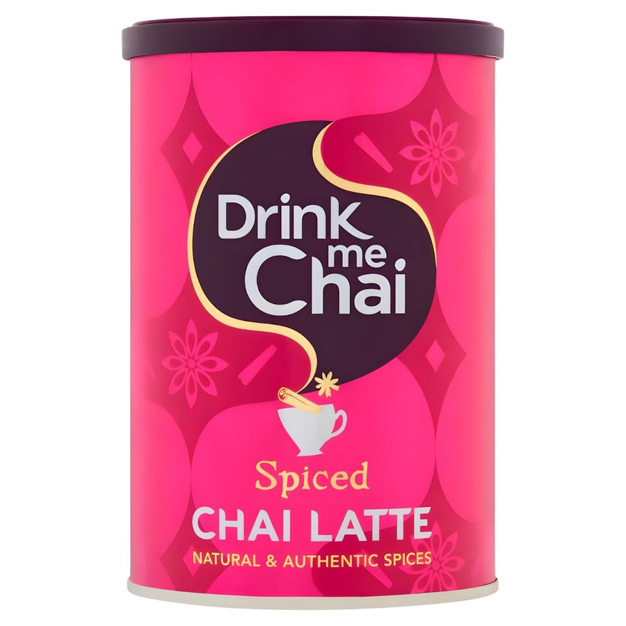 A pink cylindrical 250g container of Drink me Chai Spiced Chai Latte by Drink me Chai, featuring a teacup graphic and bold white and yellow text. Contains a sweetened black tea chai blend with natural and authentic spices.