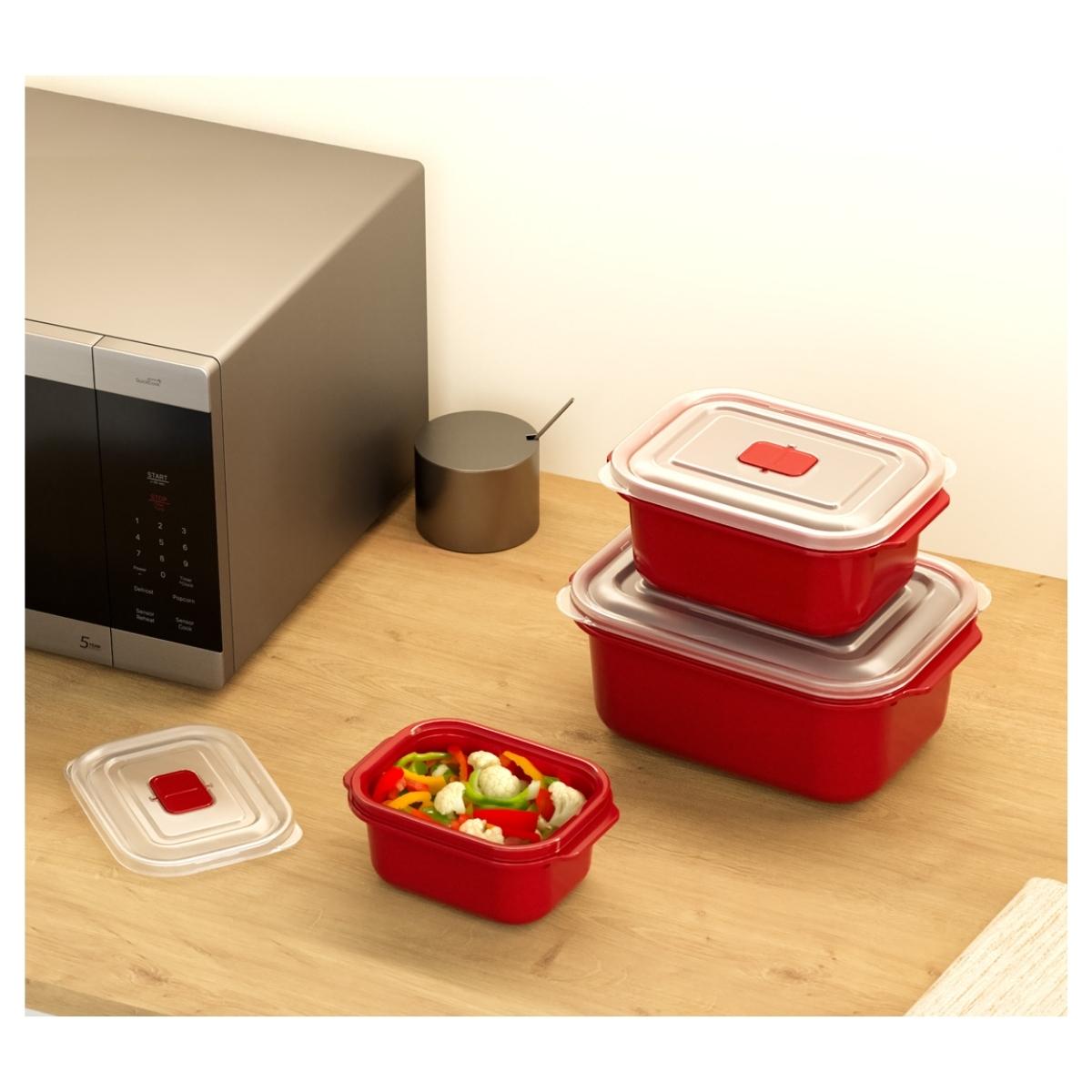 Three Dunya - Heat'n Go Microwave Container Set - 3Pcs in red, with clear lids, are on a wooden countertop near a microwave; one container is open and filled with chopped vegetables.
