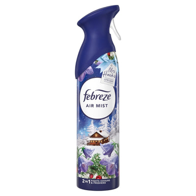 A can of Febreze - Alpine Escape Air Mist - 185ml with a winter cabin, purple flowers, snowy design, and preservatives for lasting freshness.
