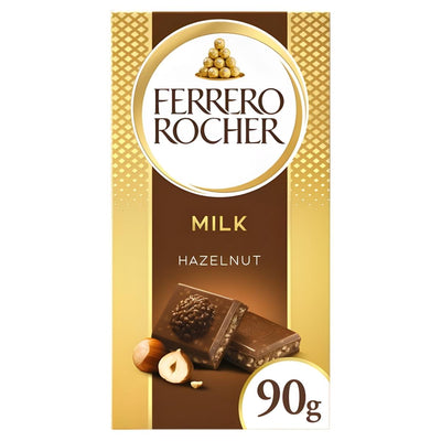 The Ferrero Rocher Milk Chocolate Bar With Hazelnuts & Cocoa Filling, 90g, features an image of two pieces of creamy milk chocolate with hazelnuts and rich cocoa filling on the front packaging.