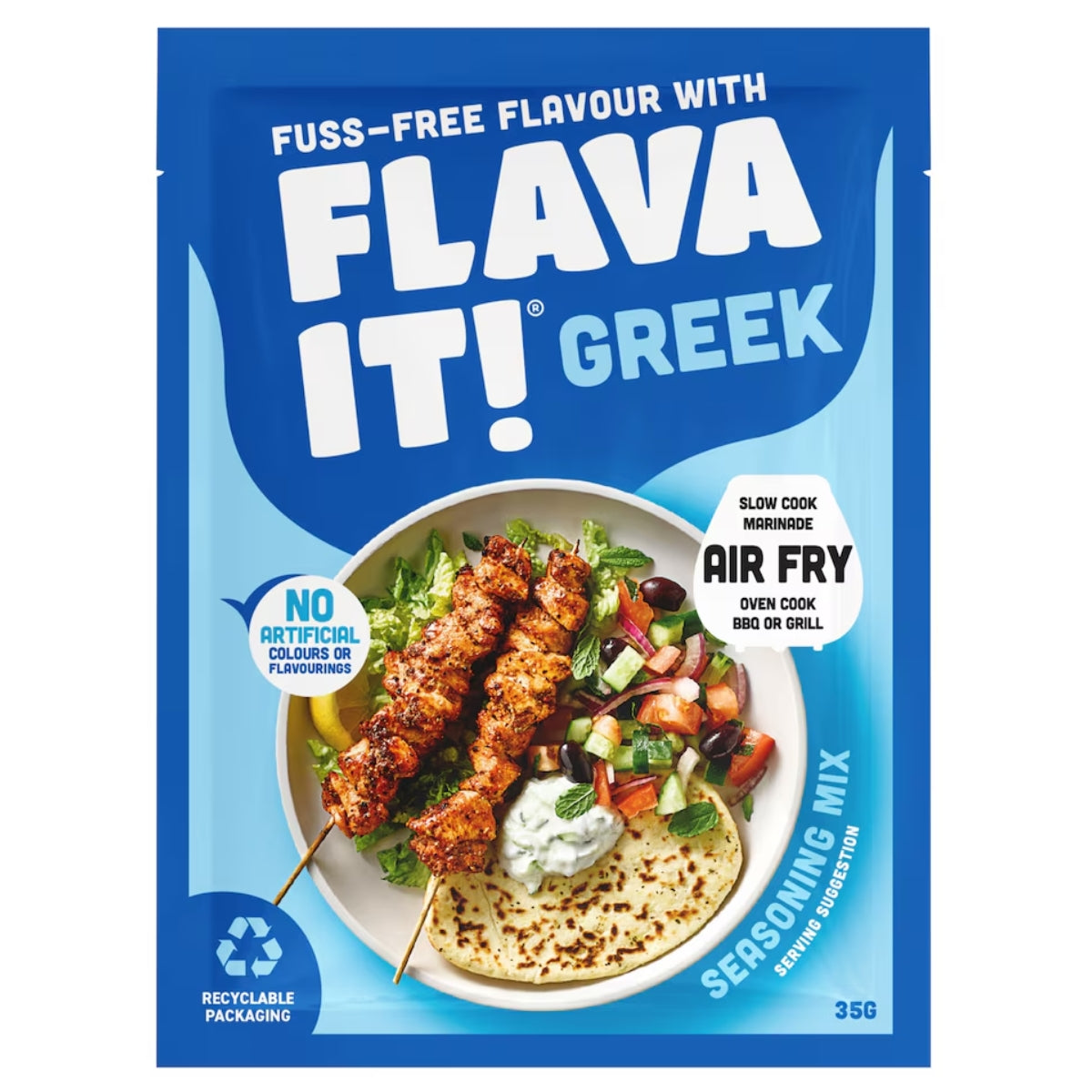 The 35g Flava It! - Greek Seasoning Mix from Flava It! features grilled skewers, salad, and pita on its packaging, with text emphasizing air fry and slow cook applications, as well as the absence of artificial colors or flavors. Infused with natural lemon flavouring, dried garlic, and ground spices, it delivers an authentic Mediterranean taste.