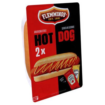 A pack of Flemmings Hot Dogs - 2pcs includes two microwavable hot dogs, with packaging showing a hot dog topped with Heinz ketchup and mustard packets.